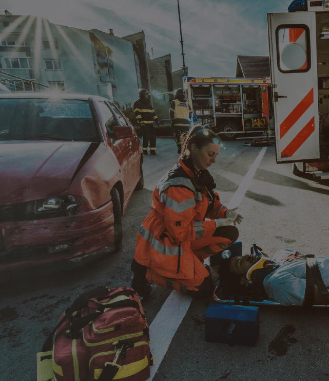 Paramedic attending car crash victim