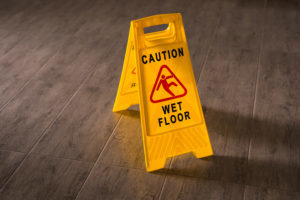 Slip and Fall Caution Sign - Sibley Dolman Gipe Accident Injury Lawyers, PA