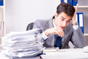 Business man struggling to file insurance claim on his own