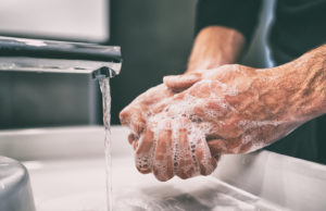 washing hands - COVID-19/ Understanding Commercial Insurance Policies That May Cover Your Business Loss and Interruption - Dolman Law Group Accident Injury Lawyers, PA
