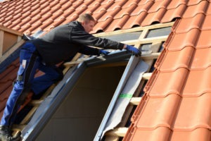 roofer installing new skylight