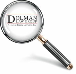 Dolman Law Group and a magnifying glass