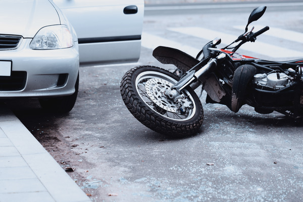 motorcycle involved in an accident with a small car