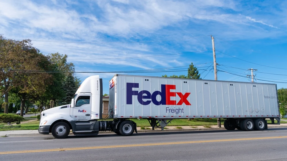 Image of a FedEx freight truck on a Florida road showing the extreme size of the tractor trailer.jpg